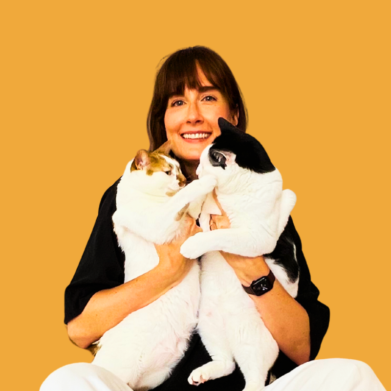 Lindsay Jones holding her two cats, Thelma and Louis